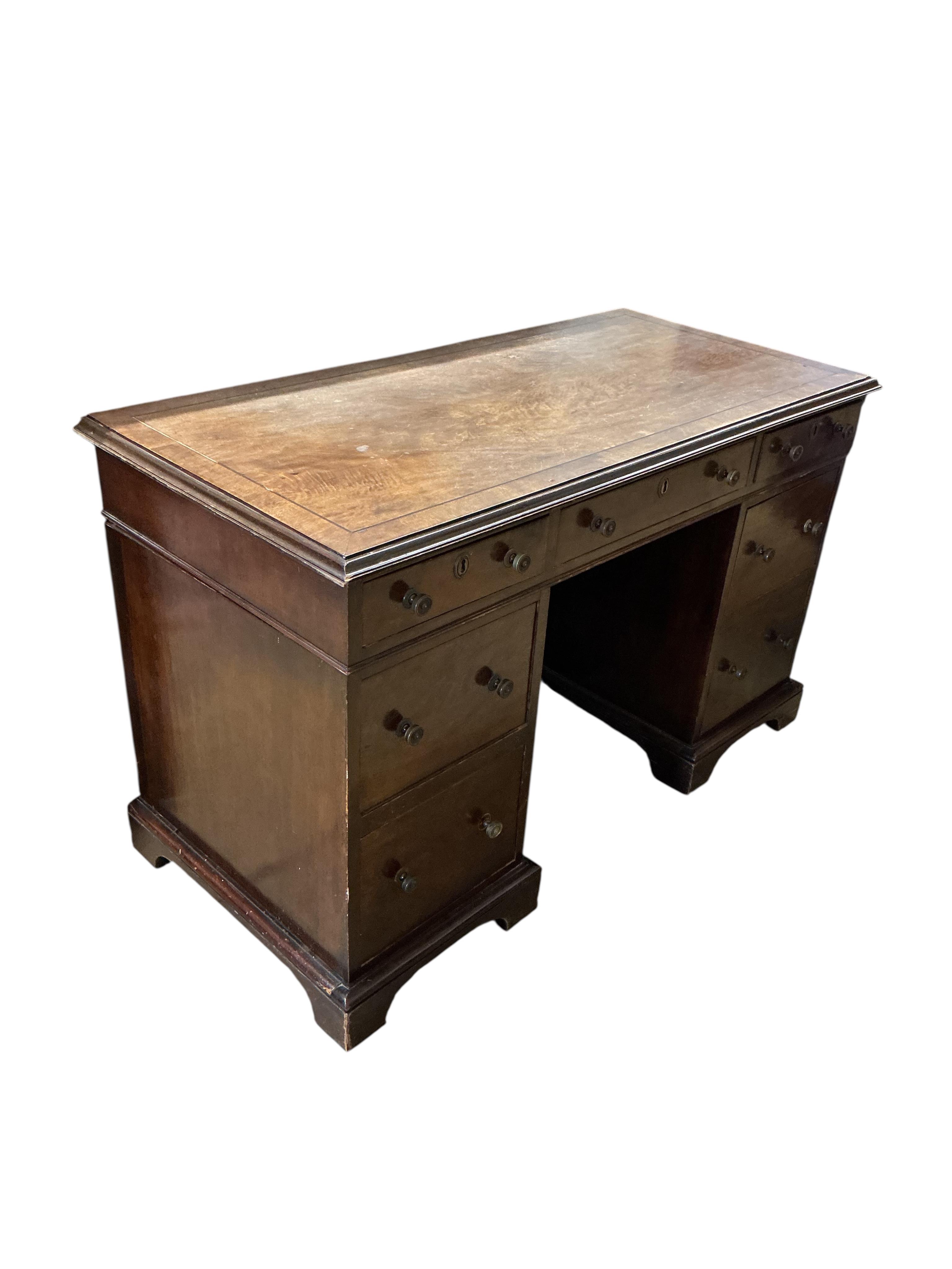 A George III style mahogany pedestal desk, width 122cm, depth 58cm, height 74cm